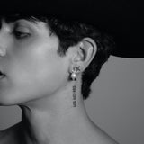 X pearl earring