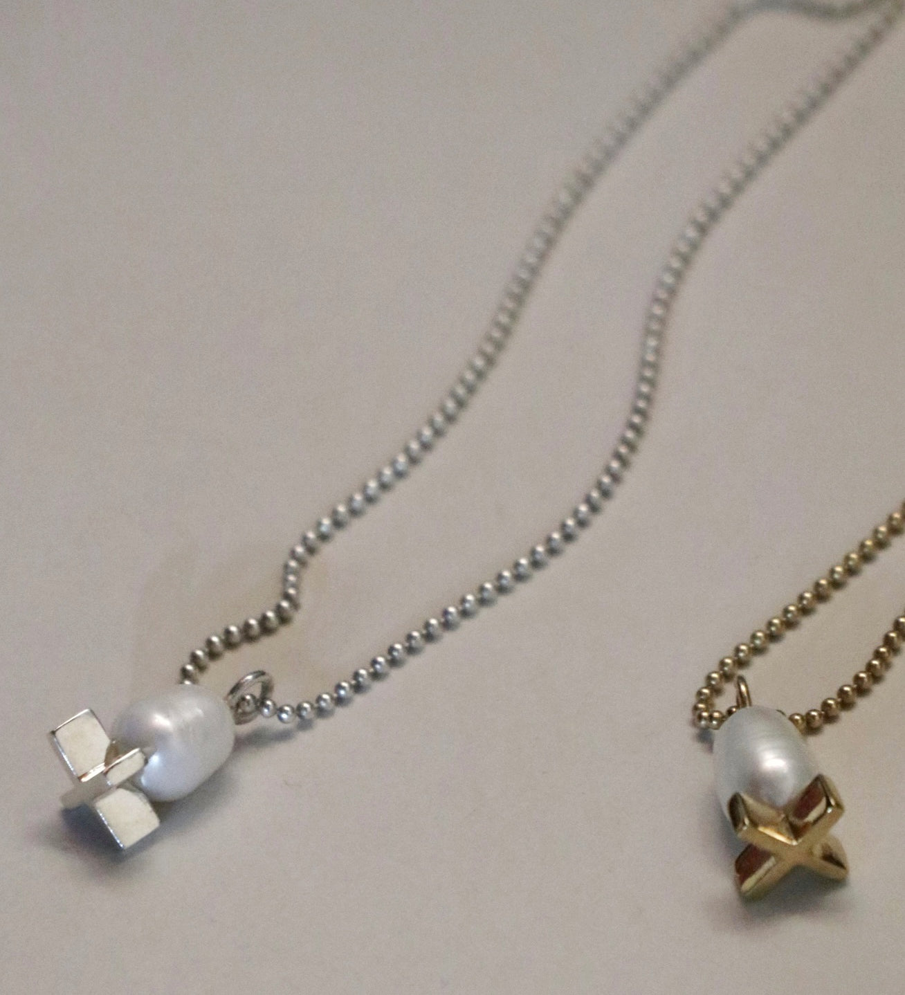 X pearl pendant