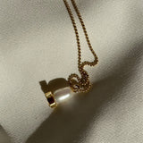 X pearl pendant